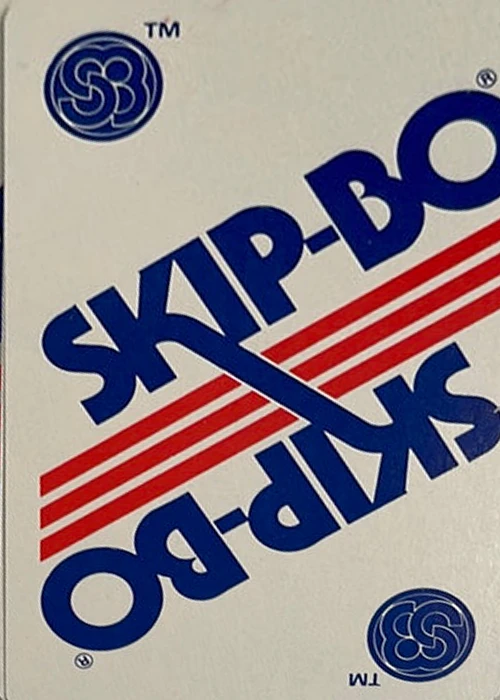 Original Skip-Bo card back with a cream background, blue lettering, and red stripes
